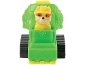 Puppy figure in a green construction vehicle with black tracks.