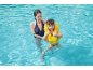 Mother and child in a swimming pool, child wearing a yellow swim vest.