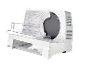 Electric slicer with a circular blade and a transparent food tray.