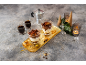 Tiramisu desserts in glasses, espresso, and a moka pot on a festive table.