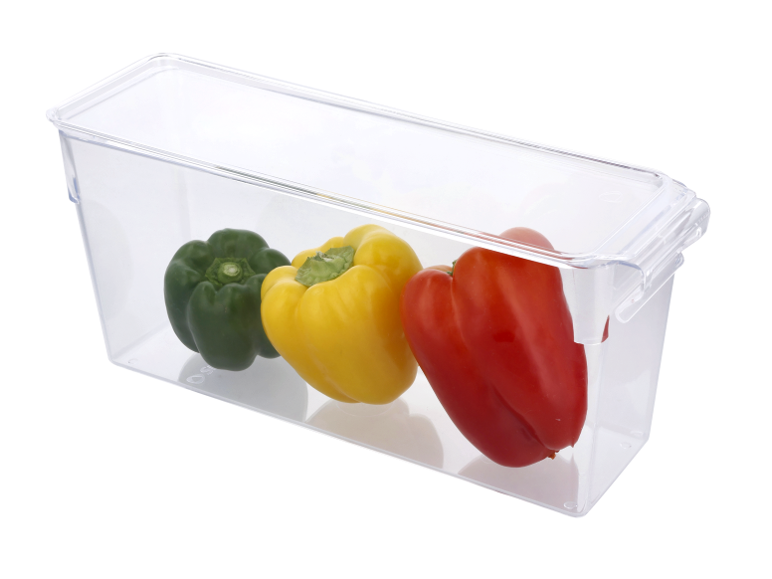 Three bell peppers (green, yellow, red) in a clear rectangular storage container.