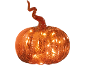 Illuminated orange glass pumpkin with a twisted stem on a black background.