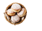 Sugared doughnuts in a wicker basket with a linen cloth
