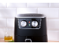Black air fryer with silver temperature and time control knobs