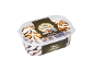 Cappuccino ice cream with tiramisu sauce and chocolate spheres in a transparent container.