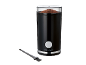 Black electric coffee grinder with ground coffee and a cleaning brush.