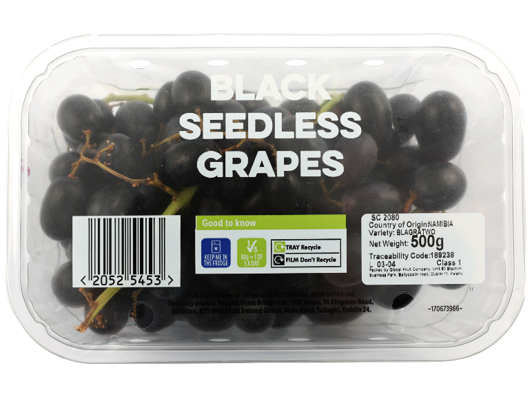 Black seedless grapes in a clear plastic container with product information.