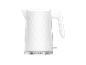 White electric kettle with a hexagonal pattern and a metallic base.