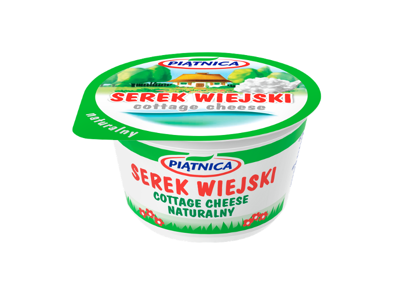Cottage cheese container with a rural landscape illustration and a spoon of cottage cheese.