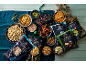 Assortment of crisps, popcorn, and dips on a festive table.