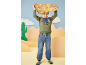 Boy in dinosaur sweatshirt and jeans holds a treasure map above his head.