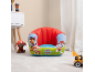Children's inflatable armchair with cartoon dog characters in a playroom.
