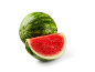 Whole watermelon and a slice of watermelon with red flesh and green rind.