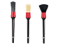 Three car detailing brushes with red ferrules and black handles.