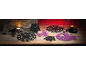 Halloween felt decorations with owls, spiders, and witches on a wooden table.