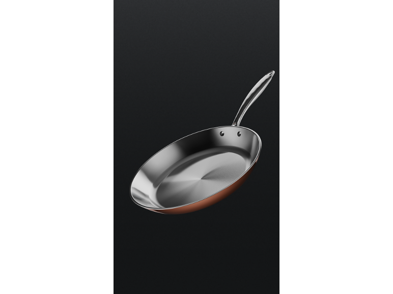 An elegant copper and steel frying pan with a long handle, against a dark background.