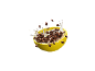 Chocolate cereal with milk in a yellow bowl, splashing in the air.