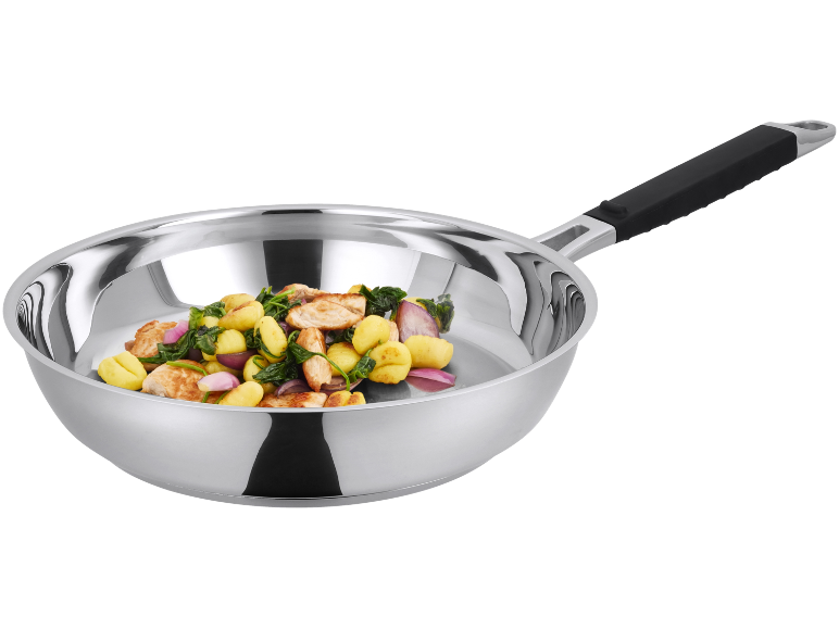 Stainless steel frying pan with chicken, gnocchi, spinach, and red onion.
