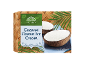 Coconut flavour ice cream in coconut shells, on a bamboo background with a tropical leaf.