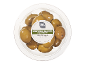 Halkidiki olives from Greece with thyme and pit in a clear container.