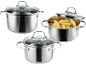 Three stainless steel pots with glass lids, one filled with cut potatoes.