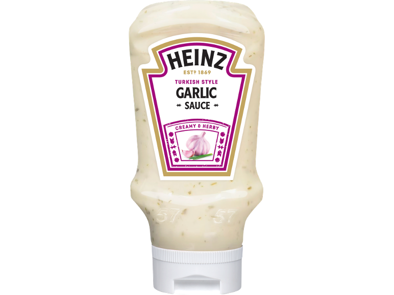 Bottle of Turkish style garlic sauce, creamy and herby.