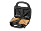 Black sandwich maker with two toasted sandwiches, open on a black background.