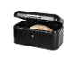 Black bread bin with an open lid and a loaf of bread inside