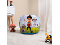 Inflatable children's pouf with cartoon characters, surrounded by toys in a room.