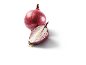 Whole red onion and a halved red onion showing its layers