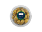 Green olives with coriander and dill in a transparent container