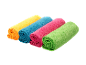Rolled yellow, blue, pink, and green microfiber cloths.