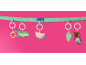 Play arch with hanging toys: alligator, watermelon, leaf, and bear.