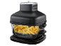 Black air fryer with a transparent bowl full of golden-brown french fries.