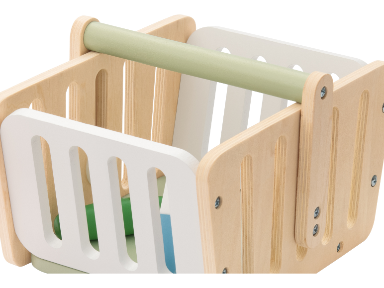 Wooden toy shopping basket with white and light green details.