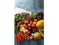 Assortment of fresh fruits and vegetables, including carrots, potatoes, green beans, and melons.