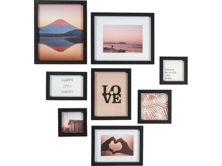 Nine black picture frames with various motifs, including a mountain, sea, text, and patterns.