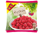 XXL frozen raspberries bag with a wooden sign and a bowl of fruit.