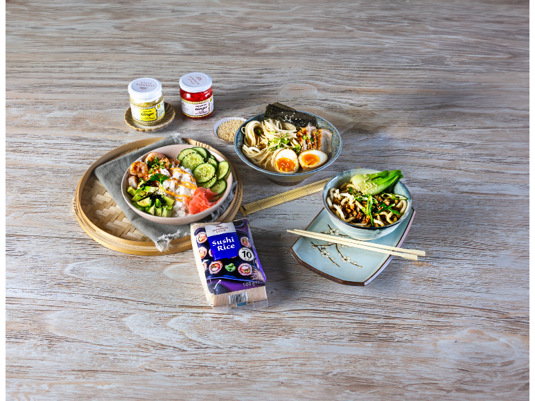 Japanese style dishes with ramen, poke bowl, and noodles, with sushi rice and ginger.