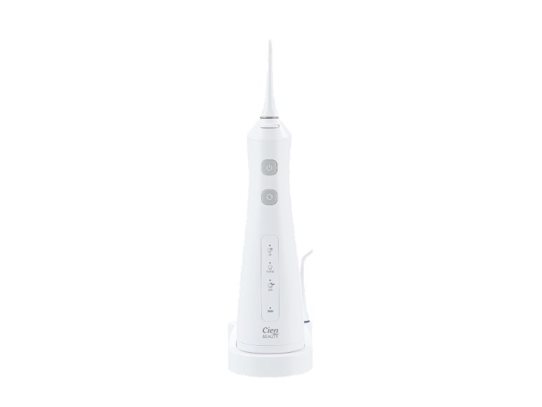 White oral irrigator with nozzle, control buttons, and mode indicators.