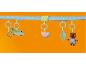 Play arch with hanging toys: crocodile, watermelon, leaf, and bear.