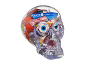 Clear skull filled with assorted Halloween candy, including gummy eyeballs and wrapped sweets.