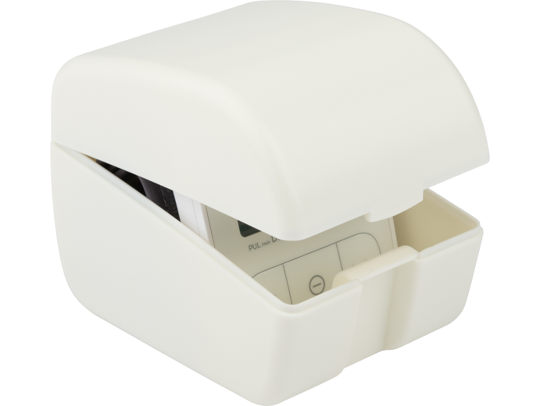 White plastic box with a blood pressure monitor inside