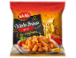 Spiced Patatas Bravas in a package, with a Mediterranean street background.
