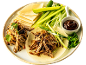 Peking duck pancakes with shredded duck, cucumber, spring onion, and hoisin sauce.