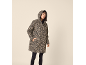 Woman in a leopard print hooded rain jacket and black leggings.