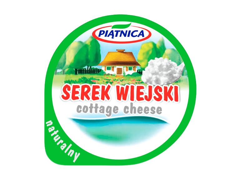 Cottage cheese packaging with a rural scene and a spoon of cottage cheese, with text 'Serek Wiejski' and 'cottage cheese'.