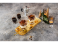 Tiramisu desserts in glasses, espresso, and a moka pot on a festive table.