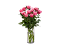 Bouquet of pink roses in a glass vase with water on a black background.
