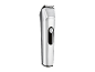 Silver hair trimmer with a black power button on a black background.